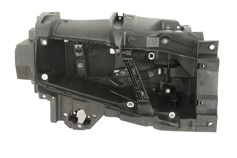 Držák hlavního světlometu plastový L VOLVO FH13 od 2005